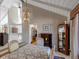 Dining area featuring a vaulted ceiling, chandelier, dining table with seating, and access to the kitchen at 10291 E Powers Ave, Greenwood Village, CO 80111