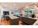 Spacious kitchen featuring dark cabinets, an island, stainless steel appliances, and natural light at 10291 E Powers Ave, Greenwood Village, CO 80111