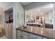 A view of the kitchen from the nearby bar area, showing the spacious layout at 10291 E Powers Ave, Greenwood Village, CO 80111