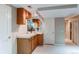 A convenient wet bar area featuring wooden cabinets, a mirror, and a sink in a well-lit space at 10291 E Powers Ave, Greenwood Village, CO 80111