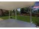 Covered back patio overlooking a spacious backyard with green grass and mature trees at 6330 E Irwin Pl, Centennial, CO 80112