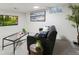 Relaxing finished basement featuring a gray couch and television at 6330 E Irwin Pl, Centennial, CO 80112
