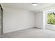 Bright bedroom features neutral walls, carpet, and natural light from a double-hung window at 6330 E Irwin Pl, Centennial, CO 80112