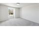 Bright bedroom features neutral walls, gray carpet, and natural light from a double-hung window at 6330 E Irwin Pl, Centennial, CO 80112