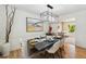 Elegant dining room featuring a modern chandelier and stylishly set table with seating for six at 6330 E Irwin Pl, Centennial, CO 80112