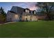 Exterior elevation with lush lawn, dormer windows, and charming white brick facade at 6330 E Irwin Pl, Centennial, CO 80112