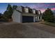 View of home featuring an attached two-car garage and driveway with a well-manicured lawn at 6330 E Irwin Pl, Centennial, CO 80112