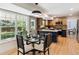 Open concept kitchen featuring quartz countertops, updated appliances, and seamless transition to the dining and living areas at 6330 E Irwin Pl, Centennial, CO 80112