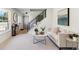 Cozy living area with natural light, a black staircase, and tasteful decor, creating a welcoming ambiance at 6330 E Irwin Pl, Centennial, CO 80112