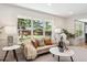 Bright living room with a large window, comfortable seating, and decorative plants for a cozy ambiance at 6330 E Irwin Pl, Centennial, CO 80112