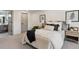 Cozy main bedroom with a comfortable bed, stylish decor, and a view to the ensuite bath at 6330 E Irwin Pl, Centennial, CO 80112