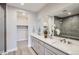 Stylish bathroom showcasing double sinks, modern cabinets, and a glass-enclosed shower at 3140 Newfound Lake Rd, Berthoud, CO 80513