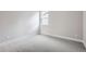 Bright, neutral bedroom with a window, carpet, and electrical outlets at 3140 Newfound Lake Rd, Berthoud, CO 80513