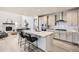 Modern kitchen with a center island, stainless steel appliances, and a view to the living room at 3140 Newfound Lake Rd, Berthoud, CO 80513