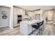 Bright kitchen boasts stainless steel appliances, a center island with seating, and plenty of cabinet storage at 3140 Newfound Lake Rd, Berthoud, CO 80513
