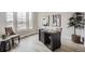 A well-lit, dedicated office area featuring a modern desk, comfortable seating, and plenty of natural light at 3140 Newfound Lake Rd, Berthoud, CO 80513