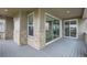 Inviting covered patio with stone accents, offering indoor-outdoor living and tranquil views at 3140 Newfound Lake Rd, Berthoud, CO 80513