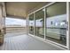 Covered patio with stone pillars and sliding glass doors, offering serene outdoor living at 3140 Newfound Lake Rd, Berthoud, CO 80513