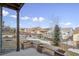 Landscaped backyard with wooden planters and a view of neighboring homes at 12597 W Big Horn Cir, Broomfield, CO 80021