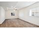 Bright basement with ceiling fan, recessed lights, carpet and 2 windows bringing in natural light at 12597 W Big Horn Cir, Broomfield, CO 80021