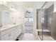 Main bathroom with double vanity and shower at 12597 W Big Horn Cir, Broomfield, CO 80021