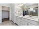 Bathroom with double sink vanity, quartz countertops, and modern fixtures and a glass shower at 12597 W Big Horn Cir, Broomfield, CO 80021