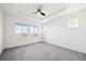 Spacious bedroom with carpeted floors and large windows at 12597 W Big Horn Cir, Broomfield, CO 80021