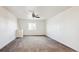 Bright and airy bedroom with carpeted floors and built-in shelving at 12597 W Big Horn Cir, Broomfield, CO 80021