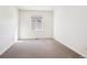 Well-lit bedroom with carpet and a window at 12597 W Big Horn Cir, Broomfield, CO 80021