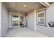 Covered deck with sliding glass door leading to interior at 12597 W Big Horn Cir, Broomfield, CO 80021