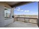 Inviting outdoor deck offering neighborhood views from behind a wood railing at 12597 W Big Horn Cir, Broomfield, CO 80021