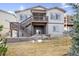 Exterior showcasing a multi-level deck, landscaped yard, and neutral color palette at 12597 W Big Horn Cir, Broomfield, CO 80021