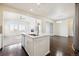 Open concept kitchen with island and views at 12597 W Big Horn Cir, Broomfield, CO 80021