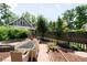 Charming backyard featuring an outdoor dining area, mature trees, and a well-maintained garden at 4363 N Raleigh St, Denver, CO 80212
