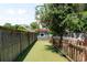This backyard features an artificial turf lawn, landscaping, and a wooden fence at 4363 N Raleigh St, Denver, CO 80212