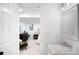 Bathroom leading into a stylish bedroom featuring modern furniture at 4363 N Raleigh St, Denver, CO 80212