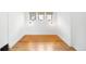 Empty room showing off the original hardwood floors and multiple windows at 4363 N Raleigh St, Denver, CO 80212
