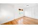 Bright bedroom with hardwood floors, built-in closet, and window with blinds at 4363 N Raleigh St, Denver, CO 80212