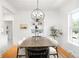 Bright dining room with hardwood floors, a modern chandelier, and ample space for entertaining at 4363 N Raleigh St, Denver, CO 80212
