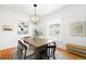 Cozy dining room featuring a wooden table, stylish chairs, hardwood floors, and natural light at 4363 N Raleigh St, Denver, CO 80212