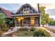Charming home with a balcony, covered porch, and wrought iron accents, located in a well-maintained neighborhood at 4363 N Raleigh St, Denver, CO 80212