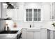 Bright, white kitchen with modern appliances, farmhouse sink, and ample counter space for cooking at 4363 N Raleigh St, Denver, CO 80212