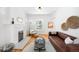 Bright living room featuring a decorative fireplace, modern furniture, and hardwood floors at 4363 N Raleigh St, Denver, CO 80212