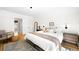 Bright main bedroom with a patterned rug, comfortable seating, and neutral decor at 4363 N Raleigh St, Denver, CO 80212
