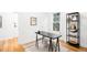 Office space featuring a modern desk, chair, and stylish shelving unit by a window at 4363 N Raleigh St, Denver, CO 80212