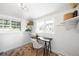 Compact office featuring floating shelves, a desk, and bright windows at 4363 N Raleigh St, Denver, CO 80212