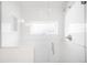 Glass-enclosed shower with white subway tile and modern fixtures at 4363 N Raleigh St, Denver, CO 80212