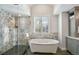 Spa-like bathroom with soaking tub and walk-in shower at 4291 W Lake N Cir, Littleton, CO 80123