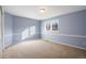 Spacious bedroom with light blue walls and neutral carpeting at 4291 W Lake N Cir, Littleton, CO 80123