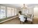 Bright dining room featuring a glass table and four chairs at 4291 W Lake N Cir, Littleton, CO 80123